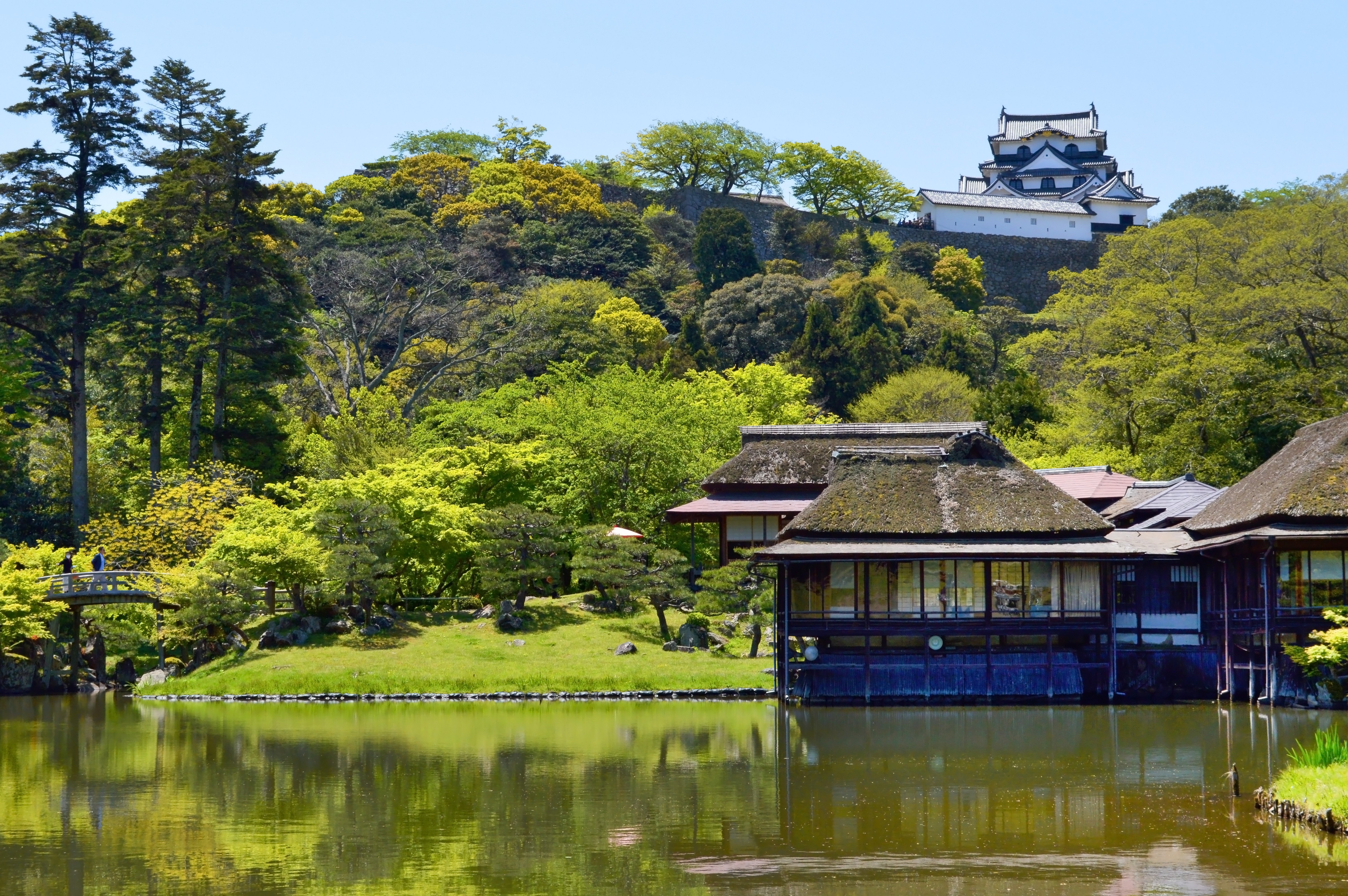 Original wooden Hikone Castle keep overlooking Lake Biwa in Shiga