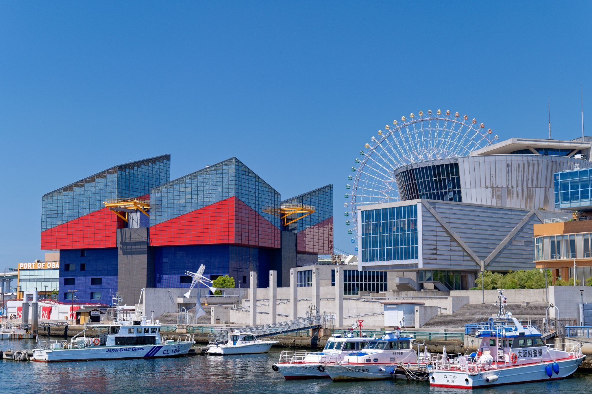 View of Osaka Aquarium Kaiyukan and the Tempozan Ferris Wheel from the Osaka Bay waterfront.