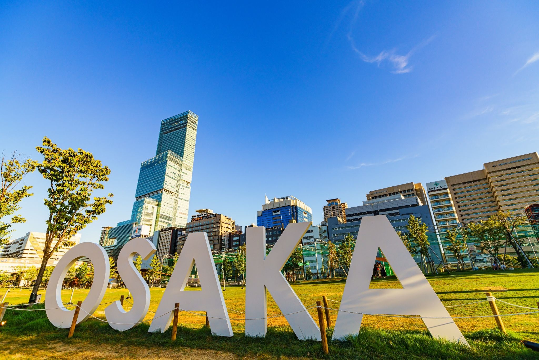 Abeno Harukas rising above the OSAKA sign and Tennoji skyline in central Osaka.
